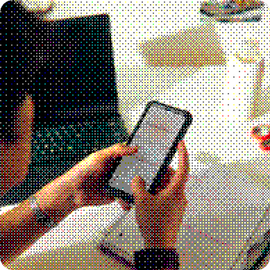 Hands holding a phone with a messaging app open