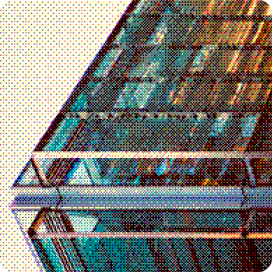 The steel and glass frame of a building seen from below
