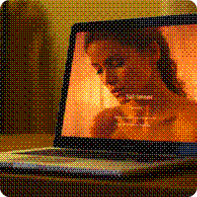 A laptop on a desk showing a website